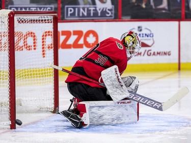 Ottawa Senators goaltender Matt Murray (30) gets some help from his goal post against the Winnipeg Jets during the second period.