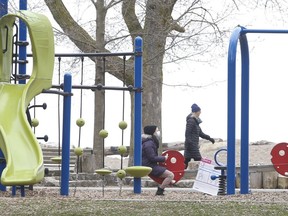 Crowds were small at the Beach and a few people used the playground near the Olympic pool as the Ford government walked back its latest province-wide stay-at-home restrictions and allowed parks to remain open.