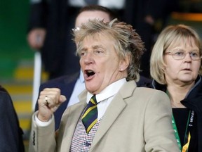 Rod Stewart reacts in the stands during the match.