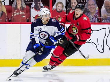 Ottawa Senators left wing Brady Tkachuk (7) pursues Winnipeg Jets defenceman Neal Pionk.
