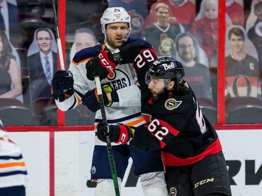 Ottawa Senators centre Clark Bishop (62) elbows Edmonton Oilers centre Leon Draisaitl.