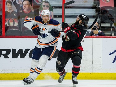 Edmonton Oilers centre Leon Draisaitl (29) high sticks Ottawa Senators centre Clark Bishop.
