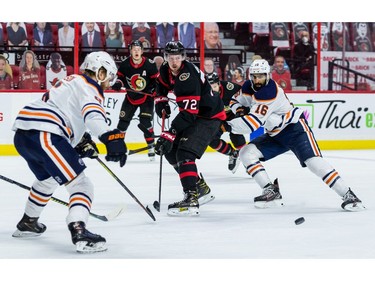 Ottawa Senators defenceman Thomas Chabot (72) makes a pass as Edmonton Oilers centre Jujhar Khaira (16) checks him.