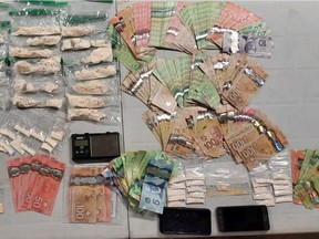 Provincial police released this image of drugs, cash and other items seized Thursday in Elgin and Kingston.