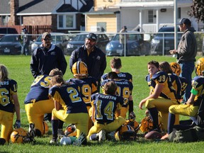 The visiting West Carleton Wolverines get some words of encouragement at halftime from coaches, during a Peewee Division NCAFA game in Cornwall in 2018.