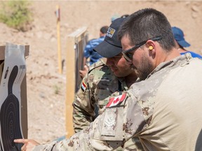 This 2019 file photo shows a Canadian Forces member at a U.S. base near Mosul teaching combat skills to Iraqi Wide Area Security Forces.