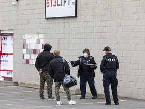 An Ottawa bylaw officer issued tickets to about a half-dozen members of 613 Lift (a weightlifting gym) outside of its door.