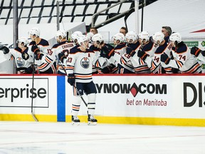 Edmonton Oilers forward Ryan Nugent-Hopkins (93) is congratulated by his teammates on his goal against the Winnipeg Jets.