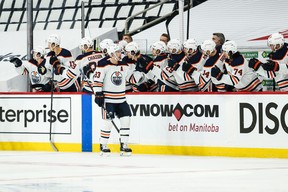 Edmonton Oilers forward Ryan Nugent-Hopkins (93) is congratulated by his teammates on his goal against the Winnipeg Jets.