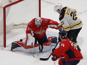 Boston Bruins left wing Nick Ritchie (21) scores on Washington Capitals goaltender Craig Anderson (31) at Capital One Arena.