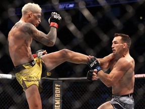 Charles Oliveira lands a kick against Michael Chandler during UFC 262 at Toyota Center in Houston, Texas, May 15, 2021.