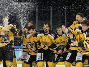Kevin Domingue (number 17) celebrates EIHL championship victory with the Nottingham Panthers.