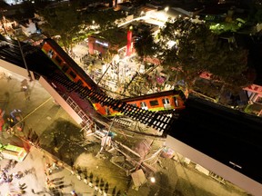 A general view of damage caused after a railway overpass and train collapsed onto a busy road in this drone picture obtained from social media Mexico City, Mexico May 4, 2021. Picture taken with a drone. INSTAGRAM @CSDRONES/via REUTERS