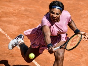 In this May 12, 2021 file photo, U.S. Serena Williams returns a shot to Argentina's Nadia Podoroska during their match of the Women's Italian Open at Foro Italico in Rome.