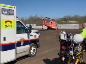Patient is transferred to ORNGE helicopter following a workplace injury .Still from video by Ottawa Paramedic Services via Twitter