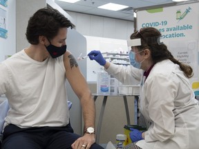 Prime Minister Justin Trudeau receives his COVID vaccination in Ottawa, Friday April 23, 2021.