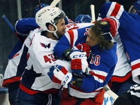 Capitlas winger Tom Wilson and Rangers star Artemi Panarin tussle during their infamous brawl on Monday. GETTY IMAGES