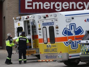 Paramedics and ambulances are seen at St. Boniface Hospital, in Winnipeg, April 8, 2021.