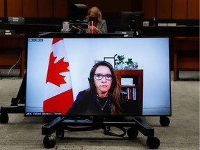 Katie Telford, chief of staff to Prime Minister Justin Trudeau, appears on a screen as she attends a House of Commons defence committee meeting on May 7, 2021.