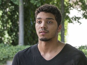 Former Carleton Ravens basketball player Edward "Eddie" Ekiyor leaves the Elgin Street Courthouse after he was released on bail following his being charged with several sexual assault related offences.