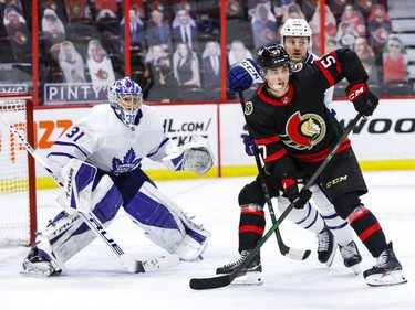 Ottawa Senators centre Shane Pinto (57) battles against Toronto Maple Leafs defenceman Morgan Rielly (44) in front of goaltender Frederik Andersen (31) during the third period.