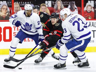 Ottawa Senators centre Josh Norris (9) splits between right wing Wayne Simmonds (24) and defenceman Travis Dermott (23) during the third period.