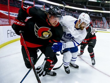 Ottawa Senators centre Logan Brown (27) and Toronto Maple Leafs left wing Nick Foligno (71) fight for position in the third period.