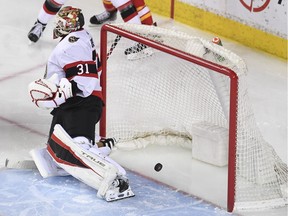 Ottawa Senators goalie Anton Forsberg (31) is scored on by Calgary Flames forward Mikael Backlund (11) (not pictured) during the second period at Scotiabank Saddledome.