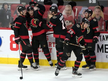 The Ottawa Senators celebrate a goal scored by defenceman Nikita Zaitsev (22 - second from left) in the third period against the Winnipeg Jets at the Canadian Tire Centre.