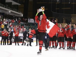 Picture of Brandt Clarke holding up championship trophy at world under 18 championships.