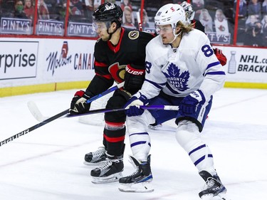 Ottawa Senators defenceman Artem Zub (2) and Toronto Maple Leaf William Nylander head into the corner.