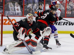 Ottawa Senators goaltender Anton Forsberg (31) follows the play as defenceman Artem Zub (2) battles with Montreal Canadiens right wing Joel Armia (40) during the second period.