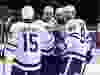 Toronto Maple Leafs Alexander Kerfoot (15), Jason Spezza (19), Jake Muzzin (8) and Joe Thornton (97) celebrate Muzzin's goal against the Ottawa Senators during the second period.