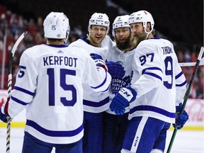 Toronto Maple Leafs Alexander Kerfoot (15), Jason Spezza (19), Jake Muzzin (8) and Joe Thornton (97) celebrate Muzzin's goal against the Ottawa Senators on May 12, 2021.