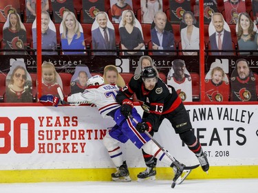 Ottawa Senators left wing Nick Paul (13) wins a puck battle against Montreal Canadiens defenceman Brett Kulak.