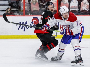 Ottawa Senators defenceman Erik Brannstrom (26) checks Montreal Canadiens right wing Tyler Toffoli (73).