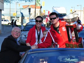 Ryan Pembroke Mayor Ed Jacyno greets Sheldon Keefe, his wife, Jackie, and their son, Landon, during a parade to celebrate the Lumber Kings' 2011 RBC Cup championship victory.