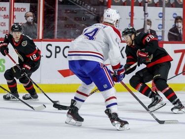 Ottawa Senators right wing Connor Brown (28) and Ottawa Senators left wing Tim Stuetzle (18) move the puck against the Montreal Canadiens.