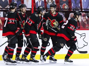 Ottawa Senators centre Shane Pinto (57), left wing Alex Formenton (59), left wing Nick Paul (13), defenceman Artem Zub (2) and defenceman Nikita Zaitsev (22) skate to the bench after Zaitsev scored against the Toronto Maple Leafs, May 12, 2021.