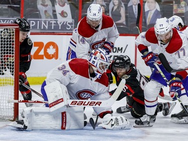 Ottawa Senators left wing Ryan Dzingel (10) and Vitaly Abramov (85) look for a rebound off of Montreal Canadiens goaltender Jake Allen.