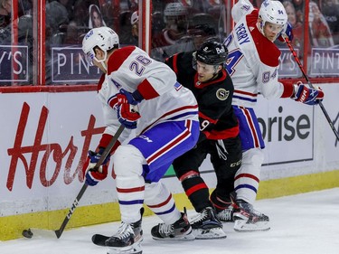 Ottawa Senators centre Josh Norris (9) battles with Montreal Canadiens defenceman Jeff Petry (26) and right wing Corey Perry (94).
