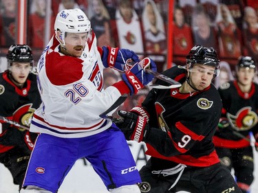 Ottawa Senators centre Josh Norris (9) battles against Montreal Canadiens defenceman Jeff Petry (26) during the third period at the Canadian Tire Centre.