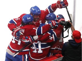 Canadiens' Shea Weber (6) jumps into the arms of teammate Jesperi Kotkaniemi (15) after Kotkaniemi scored the game-winning goal in overtime in Game 6 of the first round NHL playoff series against the Maple Leafs in Montreal on Saturday, May 29, 2021.