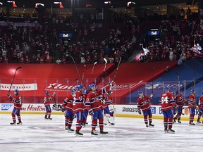 Canadiens players salute the fans following their 3-2 overtime victory against the Jets to close out the North Division series on Monday.