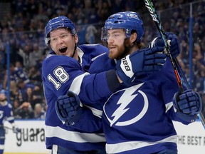 Brayden Point of the Tampa Bay Lightning celebrates with Ondrej Palat (18) after scoring a goal during the first period in Game 2 of the Stanley Cup semifinals at Amalie Arena on June 15, 2021 in Tampa, Fla.