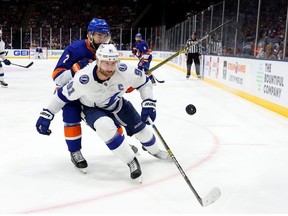 Steven Stamkos of the Tampa Bay Lightning watches the puck while followed by Jordan Eberle of the New York Islanders during the second period in Game Four of the Stanley Cup Semifinals during the 2021 Stanley Cup Playoffs at Nassau Coliseum on June 19, 2021 in Uniondale, New York.