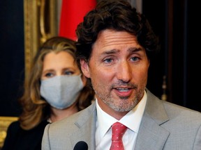 Prime Minister Justin Trudeau speaks to reporters in Ottawa with Finance Minister Chrystia Freeland in the background on Aug 18, 2020.