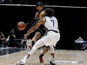 Ottawa BlackJacks forward Tyrell Green drives past Niagara River Lions forward Xavier Sneed during first half CEBL action at TD Place on Thursday night.