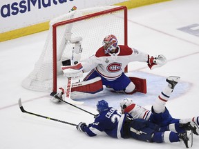 Tampa Bay Lightning winger Blake Coleman beats Montreal Canadiens goaltender Carey Price and centre Phillip Danault (24) for his last-second goal in the second period of Game 2 last night.