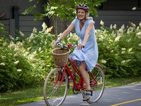 Catherine McKenna, Minister of Infrastructure and Communities and Member of Parliament for Ottawa-Centre, arrives on her bicycle to a press conference where she announced officially that she will not be running in the next election, in Ottawa on Monday, June 28, 2021.
